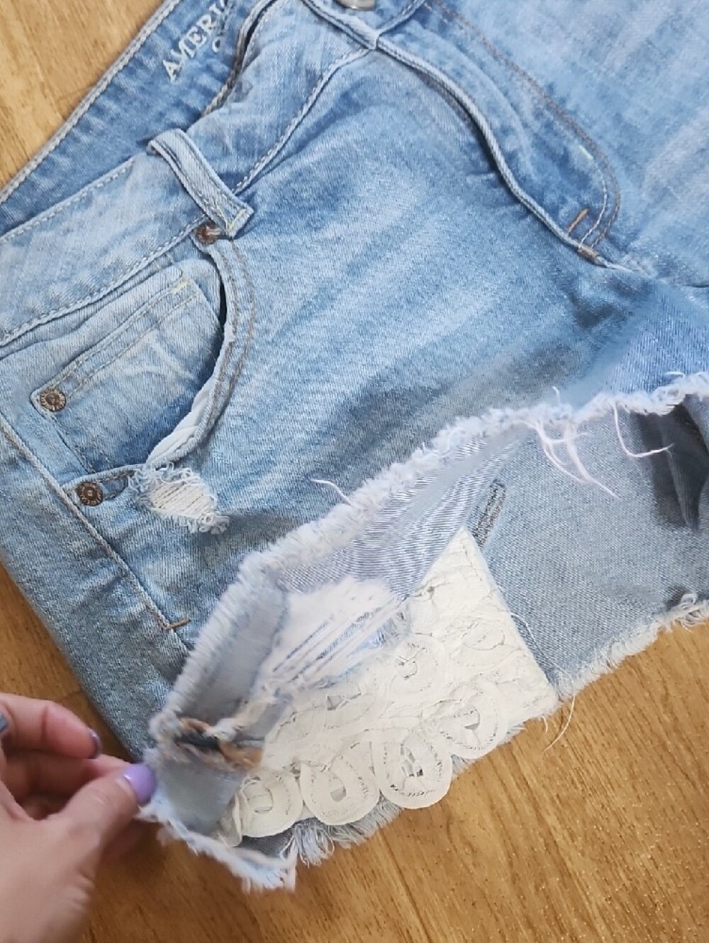 American Eagle Outfitters Light Blue Distressed Denim Shorts with Lace Hem - Picture 5 of 5